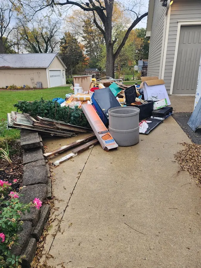Dumpster being loaded with debris for 30 Yard Dumpster Rental in South Lyon
